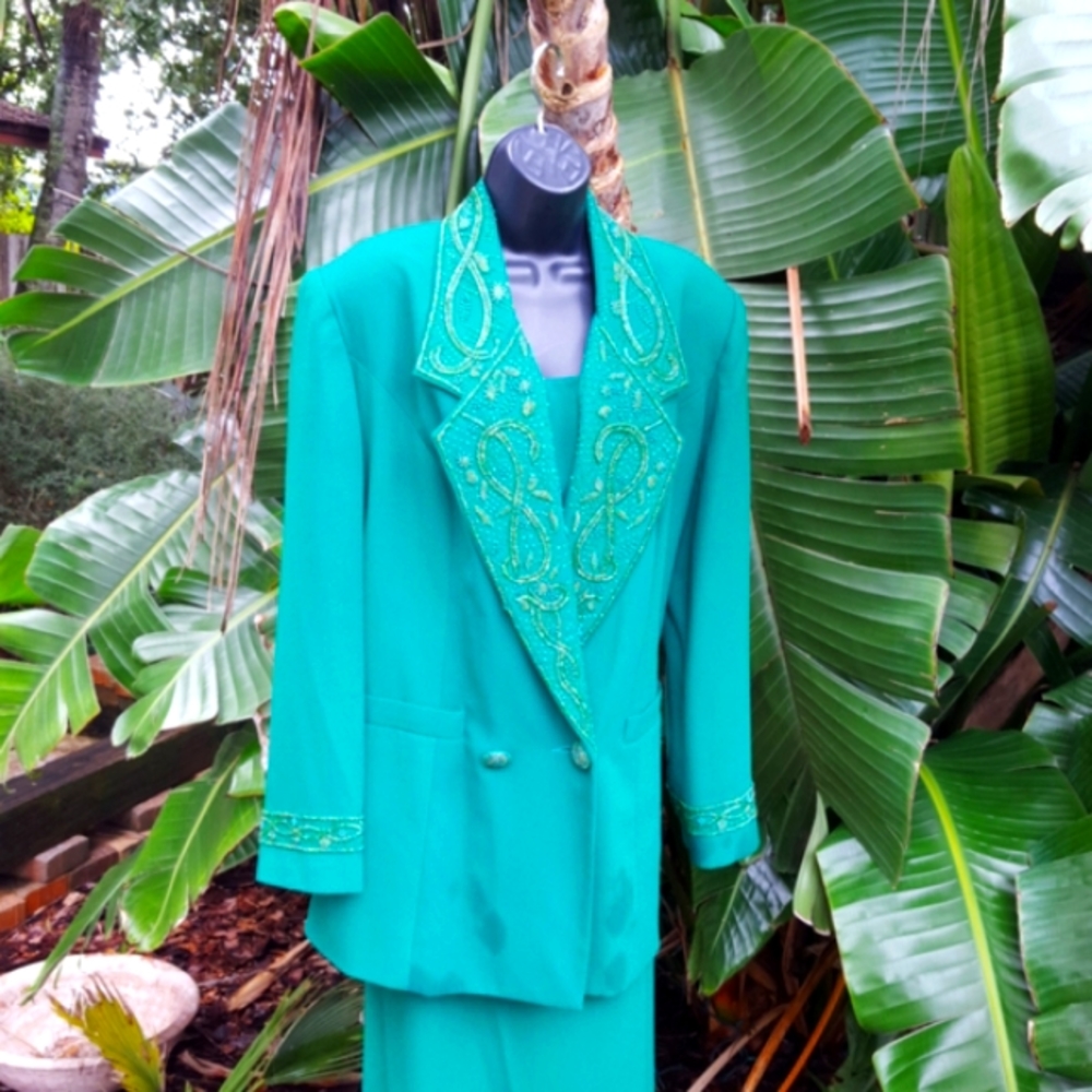 longline jacket beaded suit with 80s power shoulders and maxi skirt